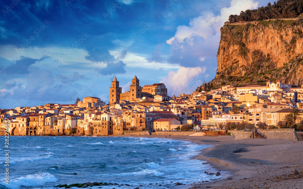 Sunset view of beautiful Cefalu, small resort town on Tyrrhenian coast of Sicily, Italy