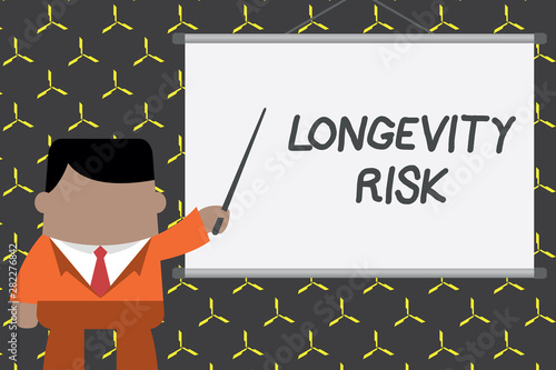 Text sign showing Longevity Risk. Business photo showcasing Potential threat due to increasing lifespan of pensioners Businessman standing in front projector screen pointing project idea photo