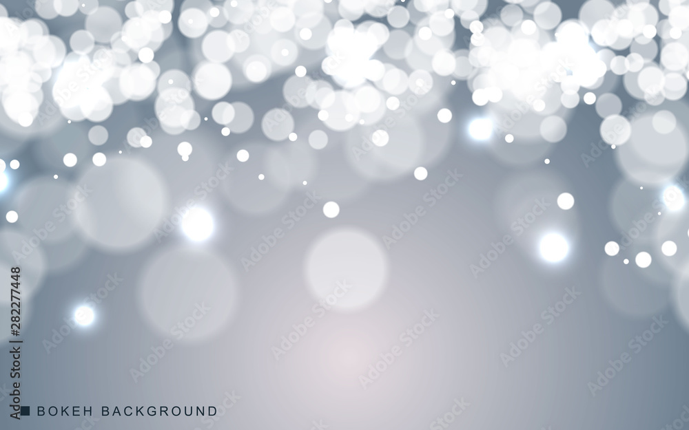 Silver abstract bokeh background sparkling lights effect. Blured circle on gray background. Silver abstract bokeh background sparkling lights effect. Blured circle on gray background.