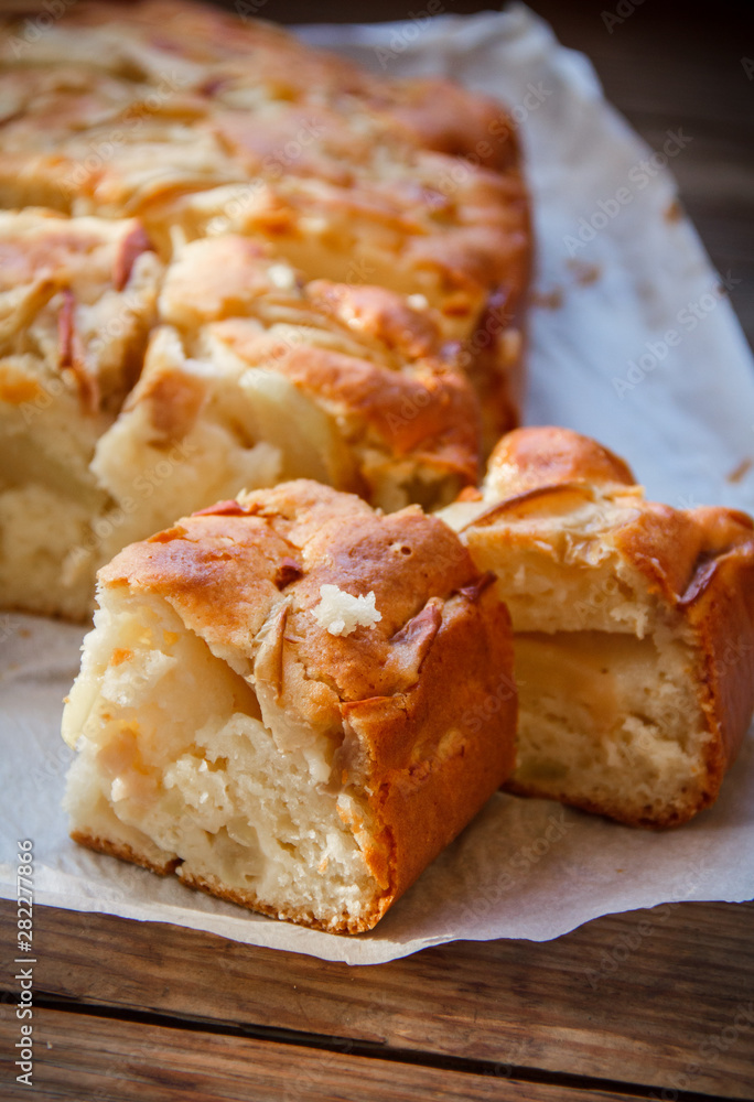 Fresh cakes. Apple pie on a wooden table. Country style.. Fresh cakes. Apple pie on a wooden table. Country style..
