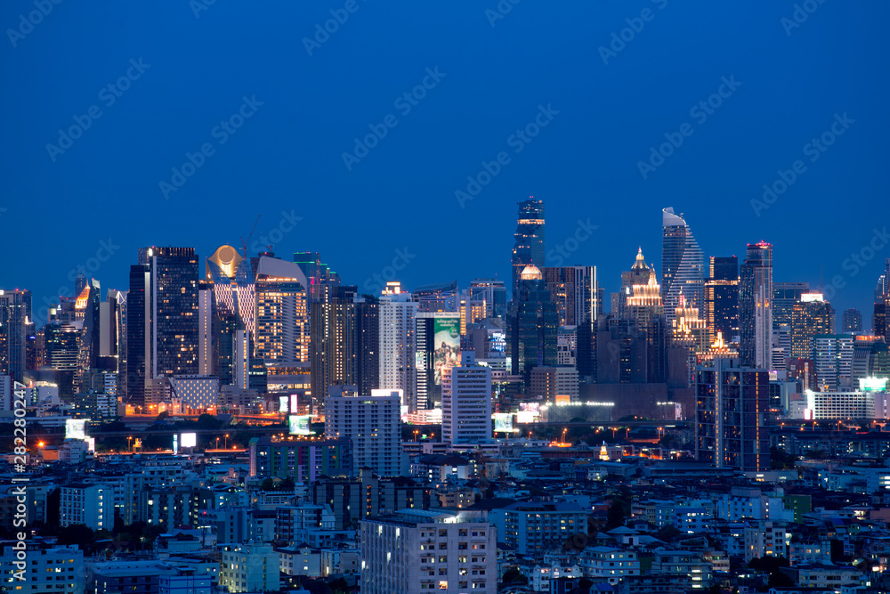 Bangkok city skyline at night with downtown district and business, travel area.