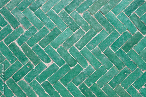 Arabic green herringbone tile pattern background