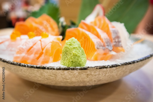 Wasabi with Fresh salmon slice sashimi serve on ice Japanese style