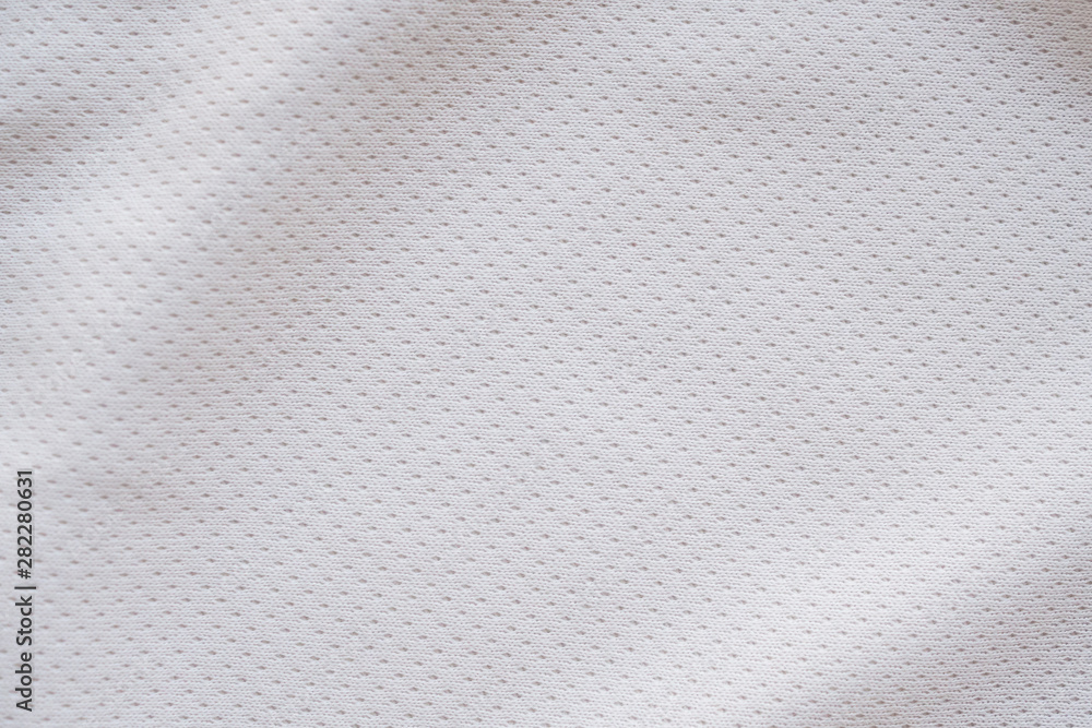 White fabric sport clothing football jersey with air mesh texture background White fabric sport clothing football jersey with air mesh texture background