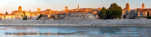 Arles. Panoramic view of the city promenade and the city at sunset. photo