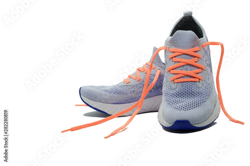 Принти на полотні Shoelaceless running shoes on isolated white background with copy space