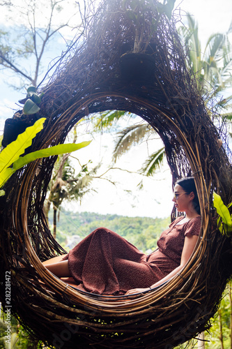 A female tourist is sitting...