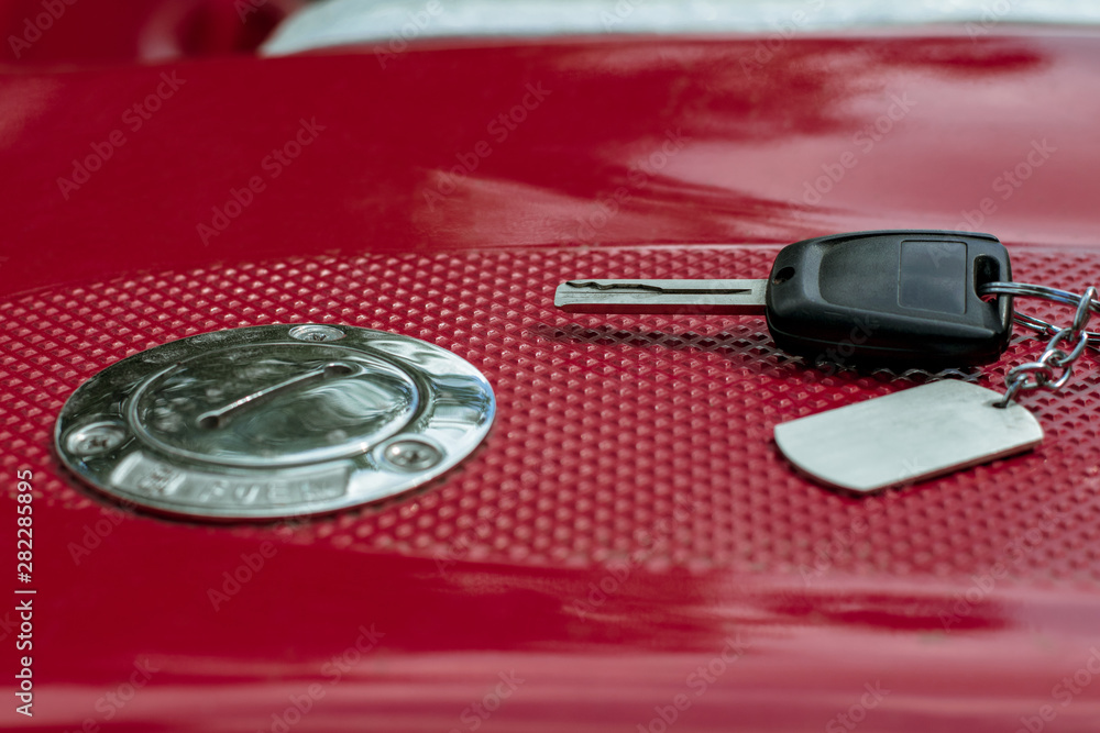 Fuel tank cap and key. Fuel cap and key on the red vehicle Fuel tank cap and key. Fuel cap and key on the red vehicle