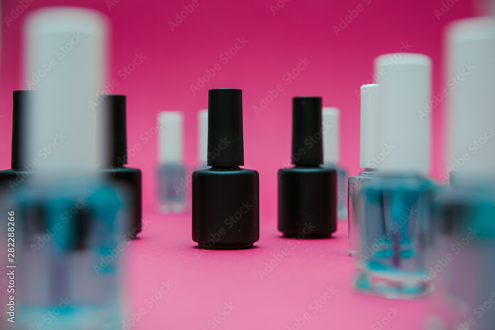 varnishes for nails on a red background in different compositions varnishes for nails on a red background in different compositions