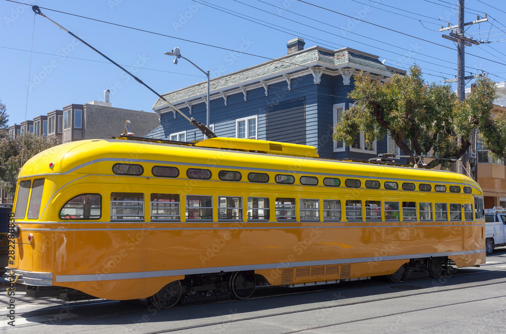 Historic yellow and orange antique San Francisco streetcar. San Francisco operates three types of Historic Streetcars: President's Conference Cars, Milan Cars, and Antique Streetcars.