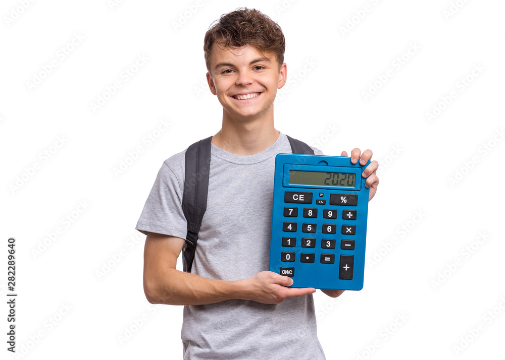 Smart student with backpack holding big calculator. Portrait of funny cute teen boy, isolated on white background. Happy child showing numerals 2020 on calculator. Back to school. Smart student with backpack holding big calculator. Portrait of funny cute teen boy, isolated on white background. Happy child showing numerals 2020 on calculator. Back to school.