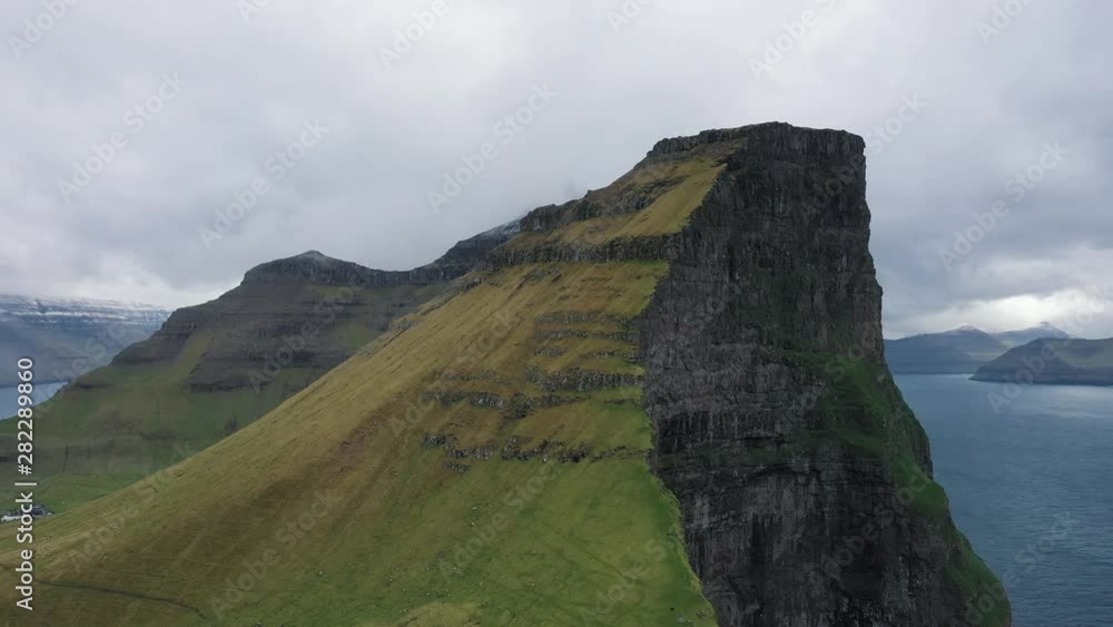 Flight around a huge cliff with on Kalsoy, Faroe Islands Flight around a huge cliff with on Kalsoy, Faroe Islands