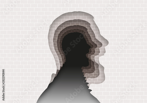 Concept des problèmes psychiatriques et de santé mentale, avec un mur de pierres dans lequel est découpé la silhouette d’une tête de profil qui hurle et se répète à l’infinie.