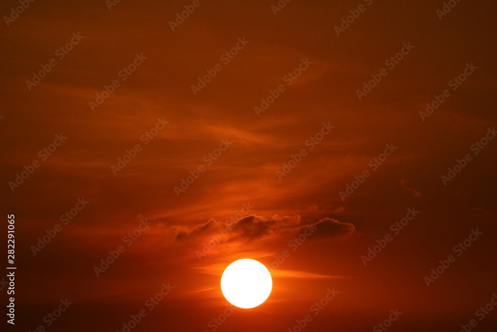 sunset on dark red orange sky back soft evening cloud over space