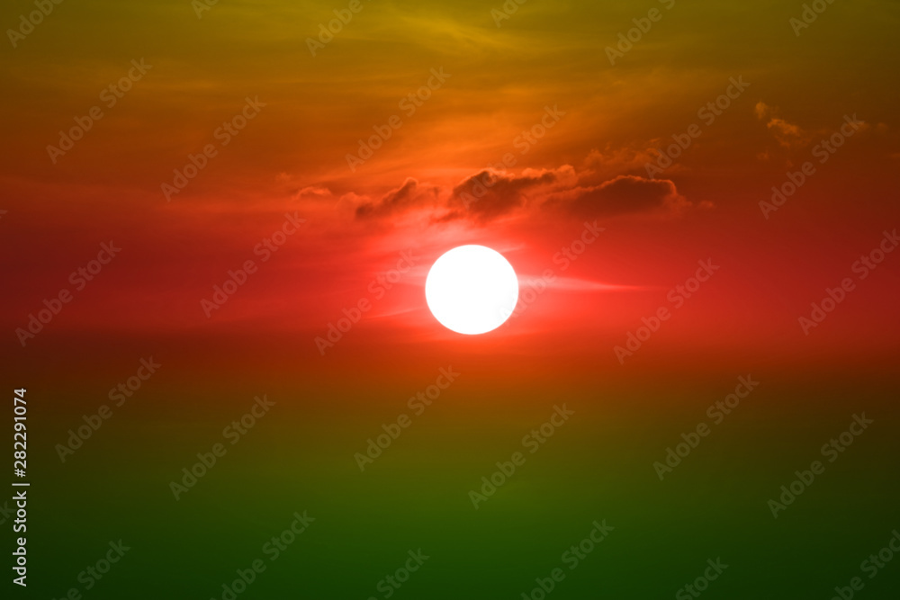 sunset on red orange green sky back soft evening cloud over space
