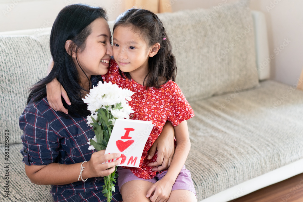 Daughter give mother day greeting card to mom Daughter give mother day greeting card to mom