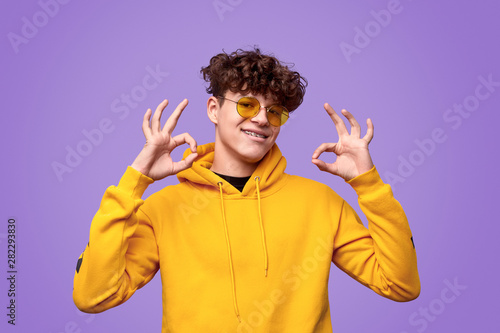 Canvas Print Happy youngster gesturing OK