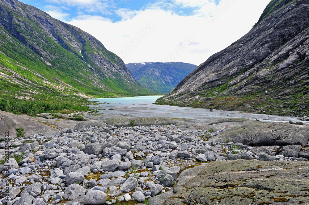 Fototapeta premium Beautiful mountain river at Nigardsbreen glacier