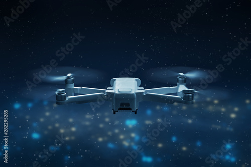 Fototapeta Naklejka Na Ścianę i Meble -  Drone quadcopter flying above city at night