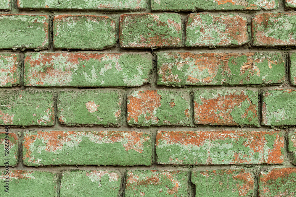 Obraz premium Old green brick wall, rustic texture, design background.