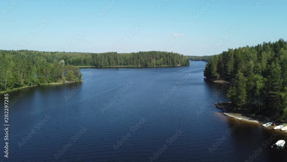 Scenic view to lake Saimaa from Toijansalmi bridge, Taipalsaari, Finland. Beautiful summer day, water surface is almost calm, just a little ripples. Scenic view to lake Saimaa from Toijansalmi bridge, Taipalsaari, Finland. Beautiful summer day, water surface is almost calm, just a little ripples.
