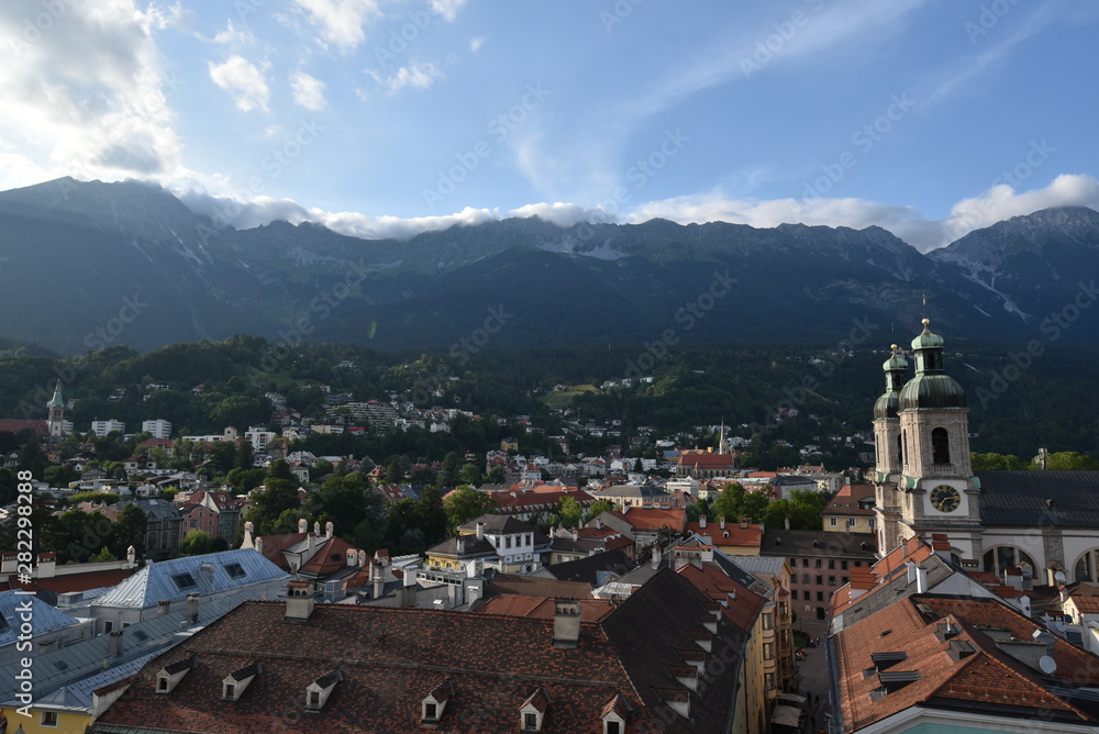 View of Innsbruck in summer from above with mountains