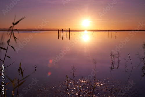 Fototapeta Naklejka Na Ścianę i Meble -  Vivid twilight sunset sky and motion blur of the sea under with long exposure effect.