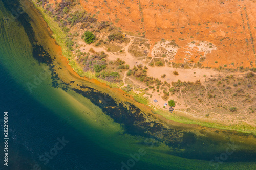 abstract view from the top onto the colorful Colorado river sand banks, natural texture and background