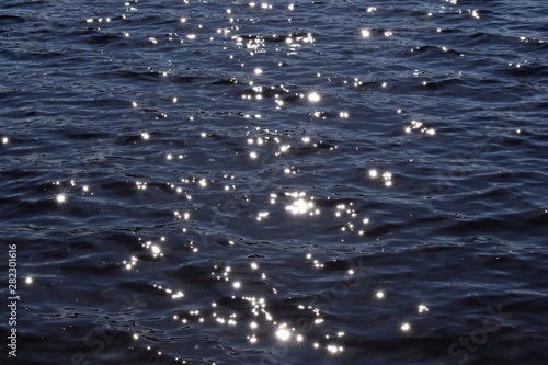 Sun reflecting stars in water