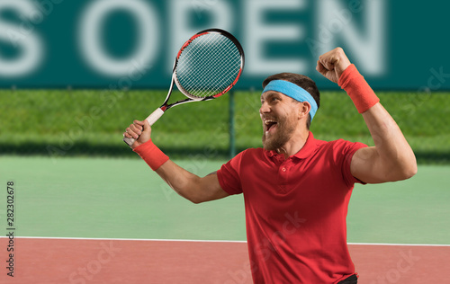 Man tennis player celebrating winner