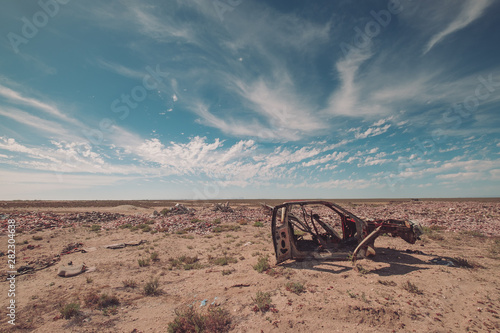 rusted car in the desert of mexico