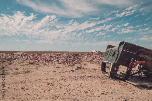 rusted car in the desert of mexico