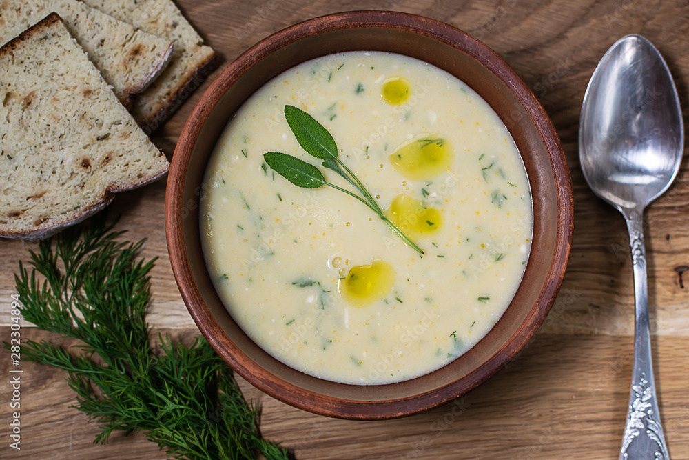 Plate of fresh homemade creamy soup with cheese, vegetables and spices. Plate of fresh homemade creamy soup with cheese, vegetables and spices.