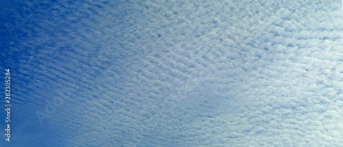 Blue sky. Small clouds. Big size pattern