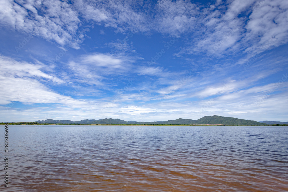 Landscape of beautiful reservoir mountain and cloudy blue sky
