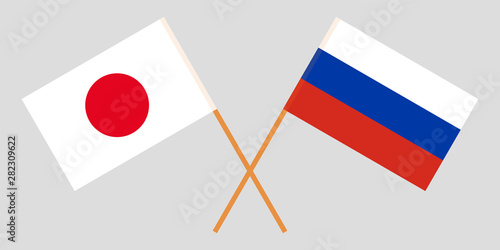 Japan and Russia. Crossed Japanese and Russian flags