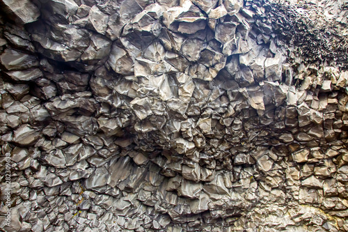 Basalt columns on a black beach in Iceland.