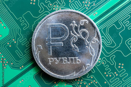 coin Russian ruble on a green background of the chip located diagonally