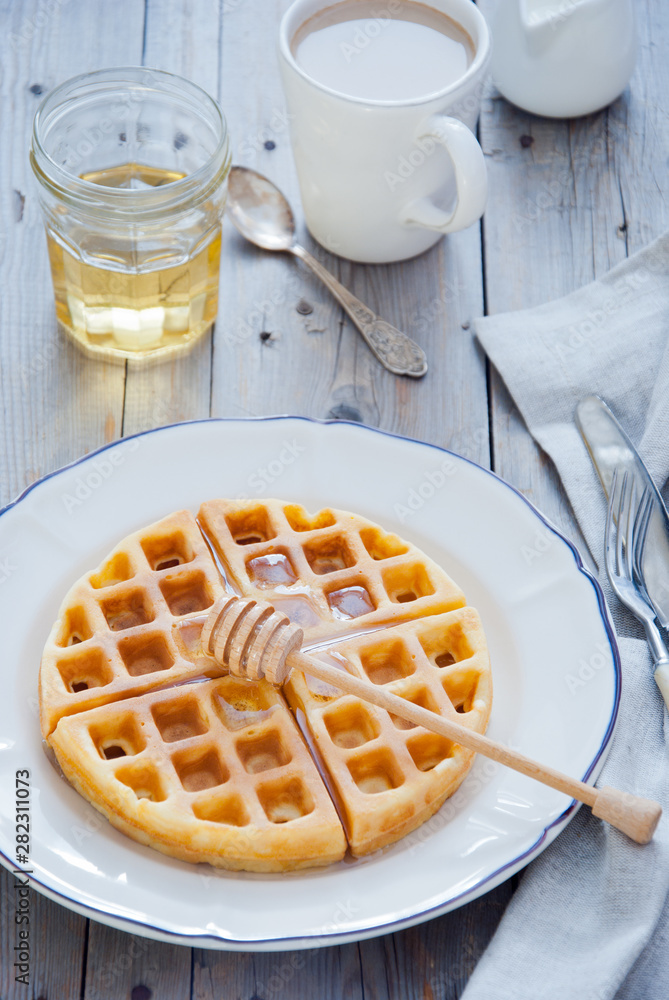 Homemade Waffles with organic honey for breakfast Homemade Waffles with organic honey for breakfast
