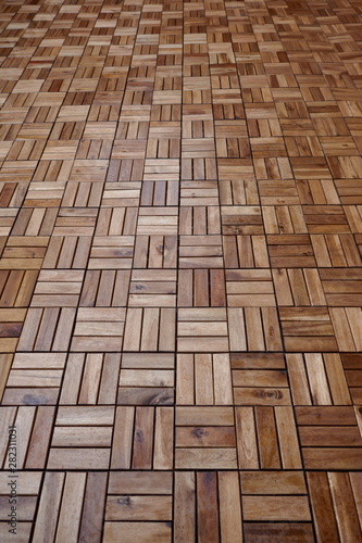 Wooden tiles, weatherproof, on the floor of the terrace of a residential building