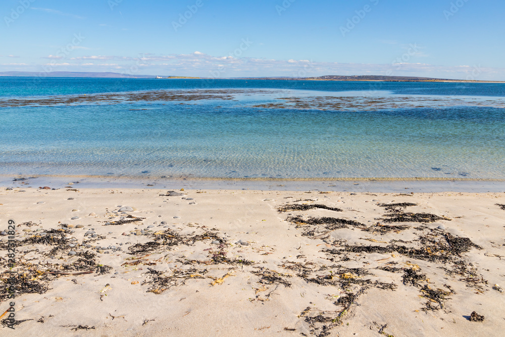 Beach with sand, rocks and seaweeds in Inishmore Beach with sand, rocks and seaweeds in Inishmore