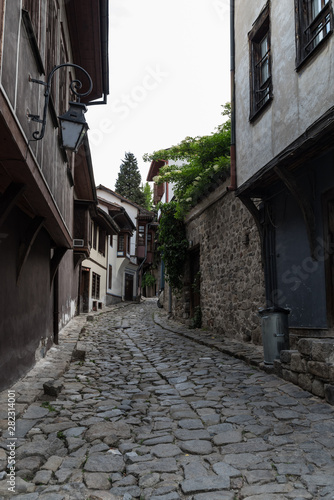  View of a narrow street in  historical part of  Plovdiv Old Town. Typical medieval colorful buildings. Bulgaria © smoke666