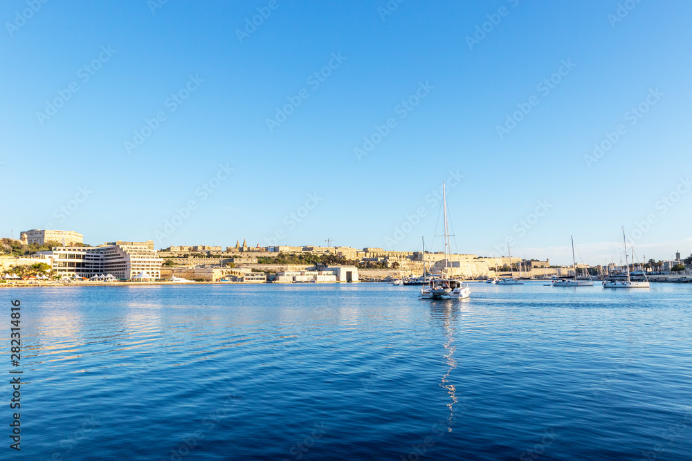 Scenic evening Valletta skyline view as seen from Manoel Island, Malta