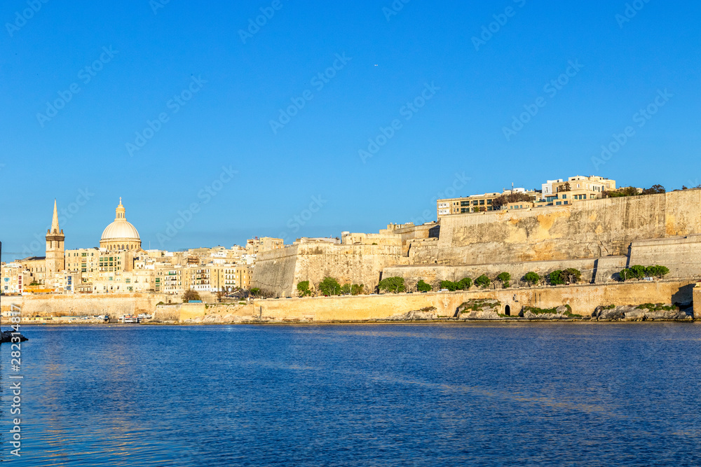 Scenic evening Valletta skyline view as seen from Manoel Island, Malta