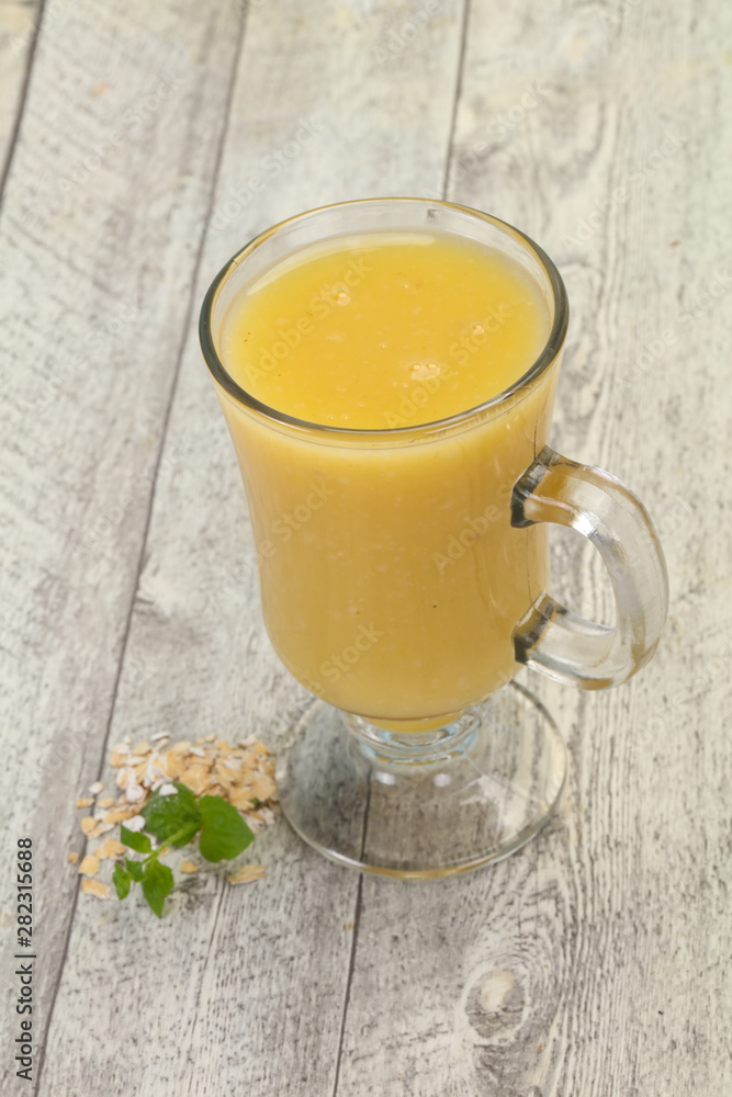 Dietary vegetarian oats milk over wooden Dietary vegetarian oats milk over wooden