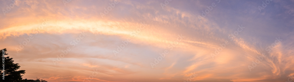 Panorama view.Beautiful view of sky and cloud at dusk,Sky Bright Blue Orange And Yellow Colors in twilight after sunset time.