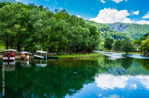 Montenegro, Many boats anchoring at riverside of crnojevica river in cetinje town waiting for tourists to do boat trip to skadar lake in national park nature photo