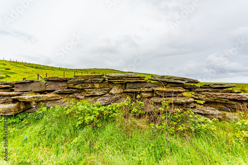 View of a natural limestone fence in ruins in the Burren, geosites and geopark, wonderful spring day in the countryside in county Clare in Ireland