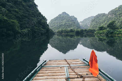 View over Tam Coc national wetlands reserve from the tourist boat in Ninh Binh, Vietnam