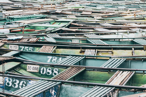 Ninh Binh, Vietnam - May 2019: pattern of tourist boats moored in Tam Coc national park